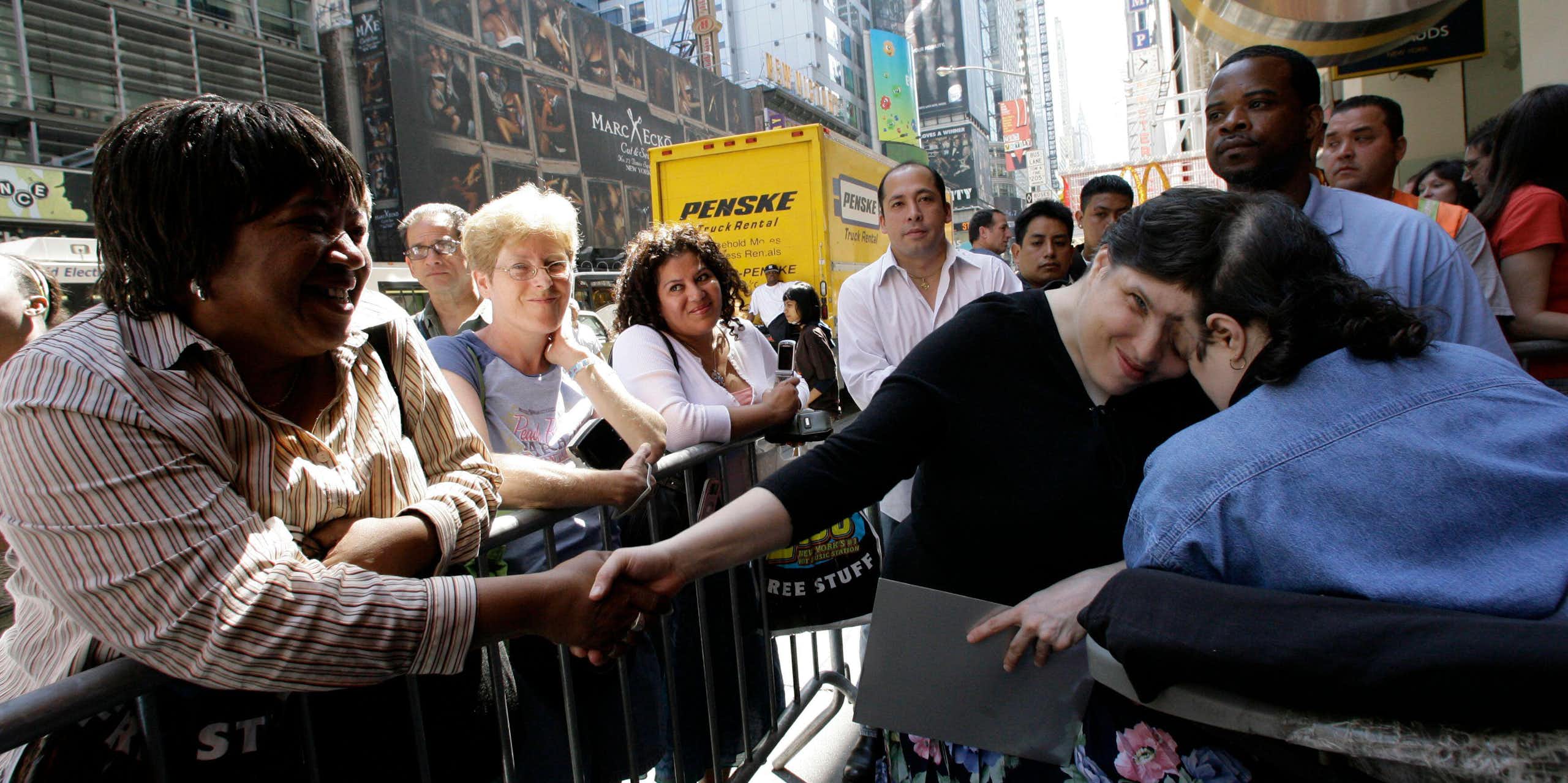  Lori and George Schappell greeting the public in Times Square, New York