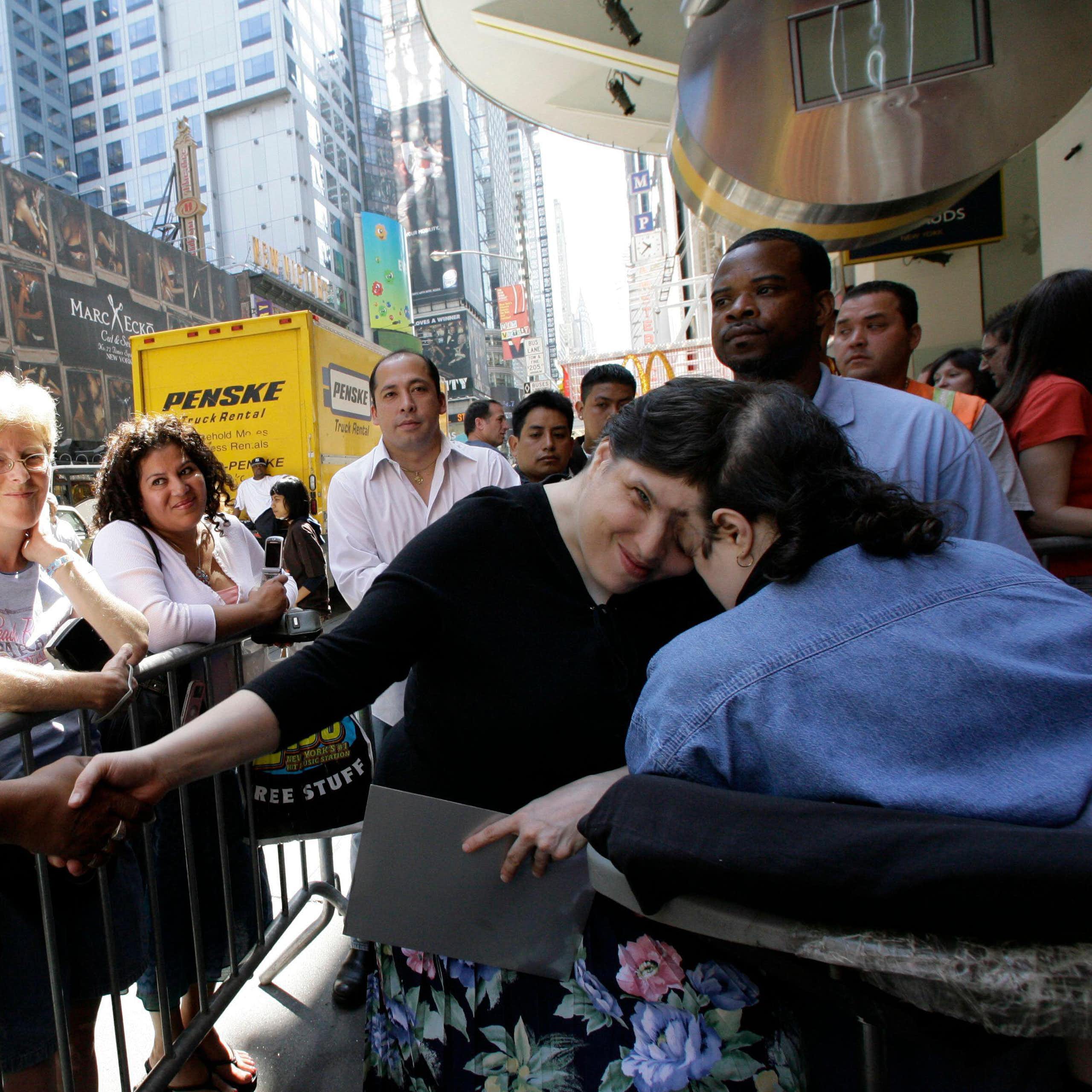 Lori and George Schappell greeting the public in Times Square, New York