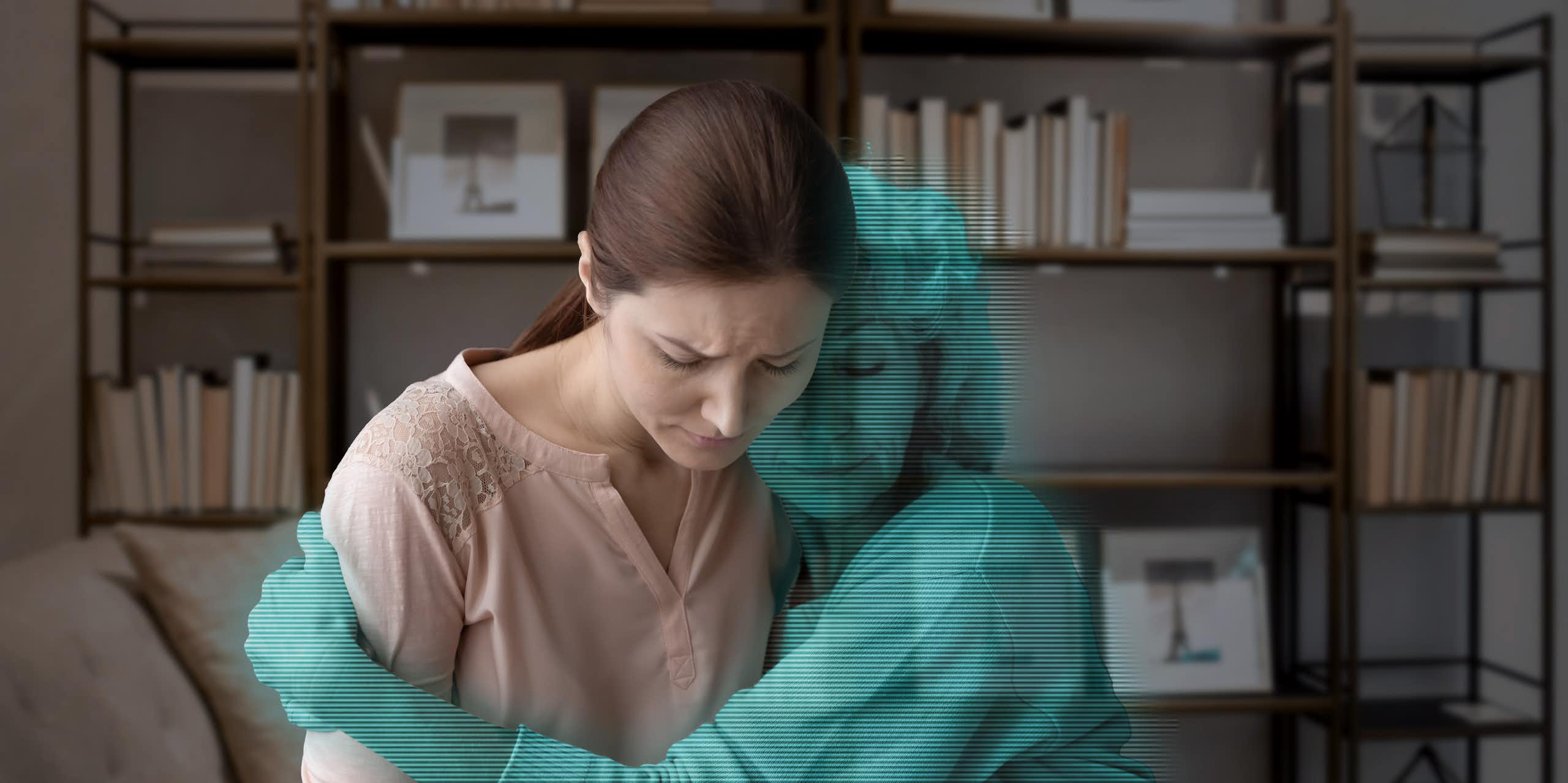Art concept: a grieving woman is hugged by a blue digital avatar of her mother.