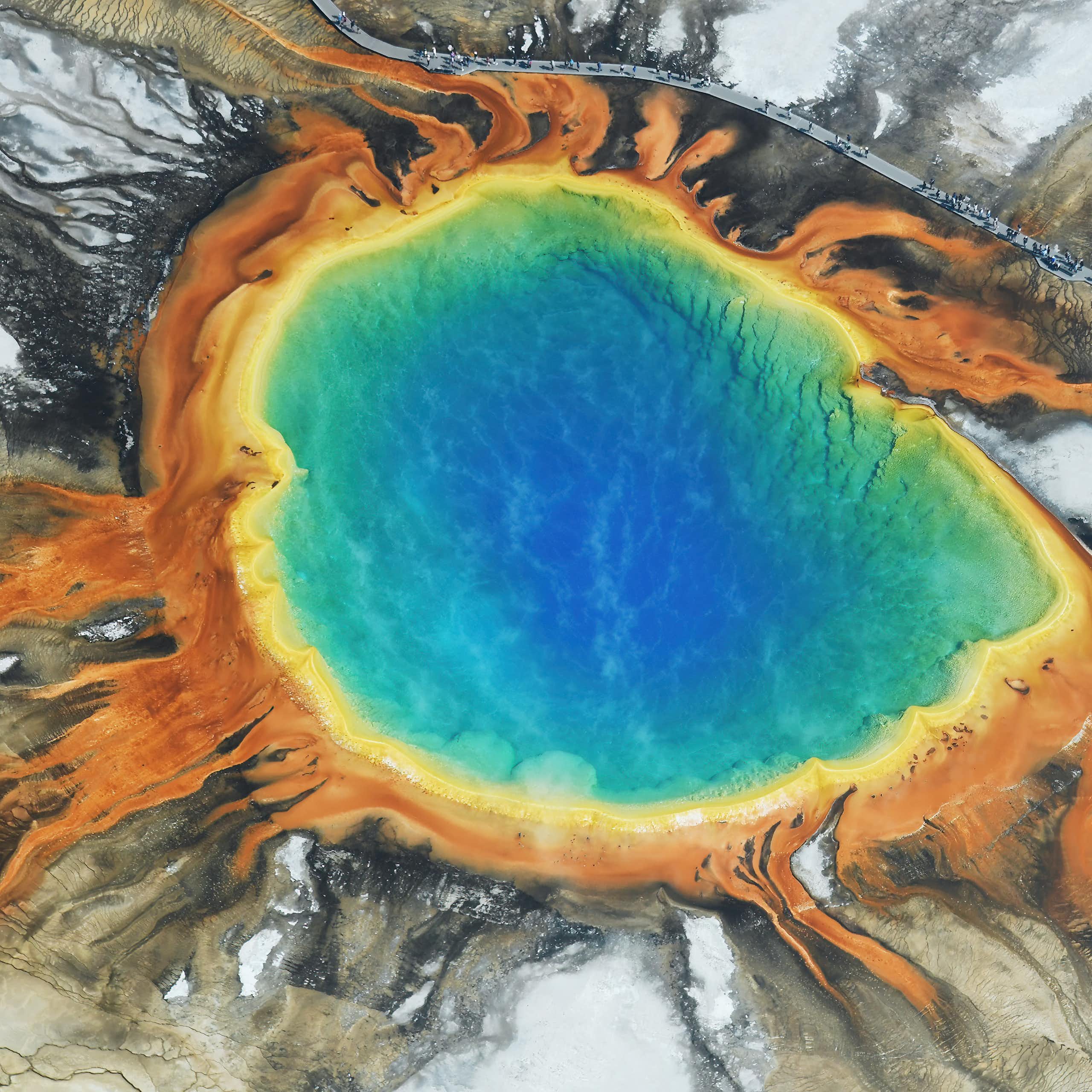 Aerial photo of a multicoloured pool of water among rocks