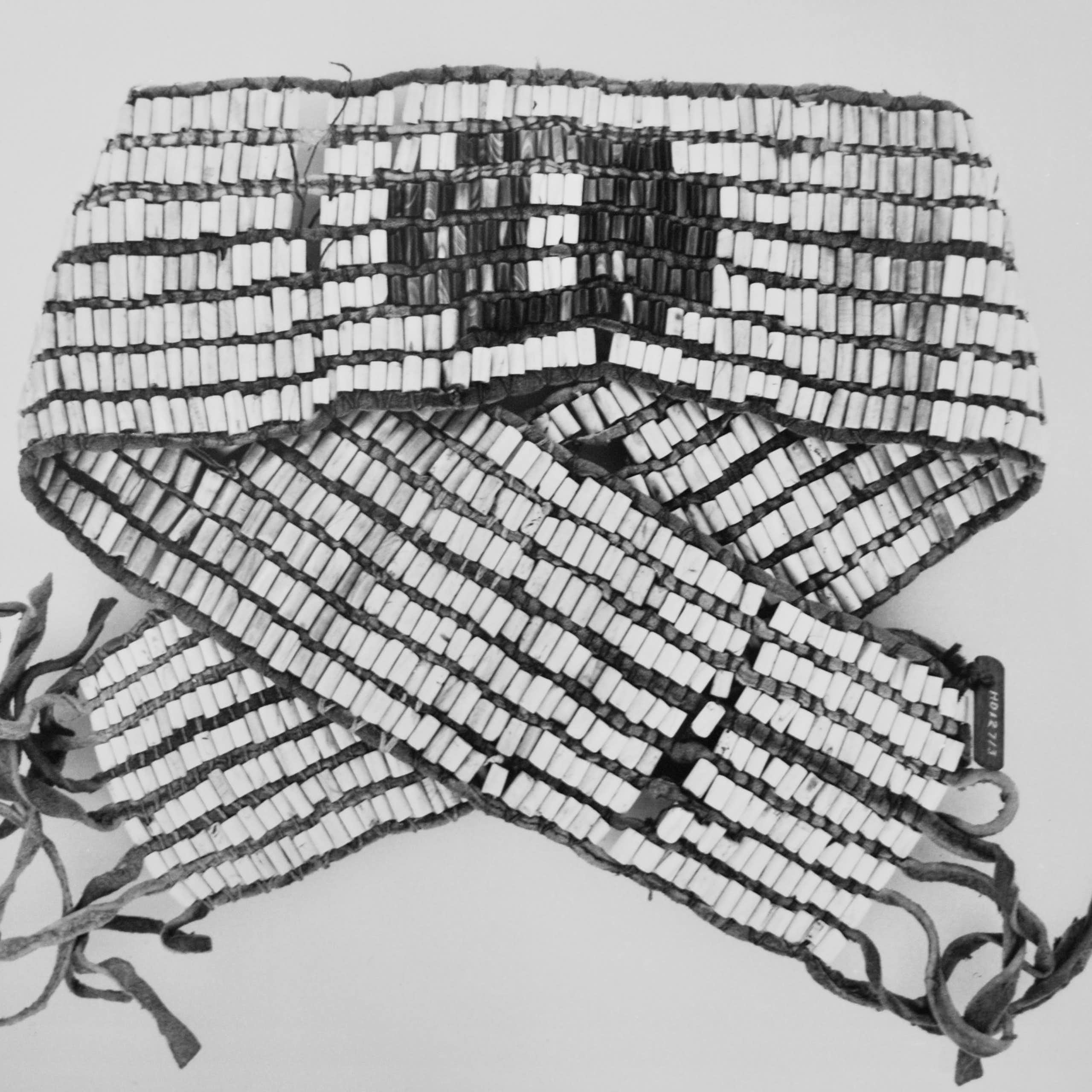  A belt woven with six rows of bead. 