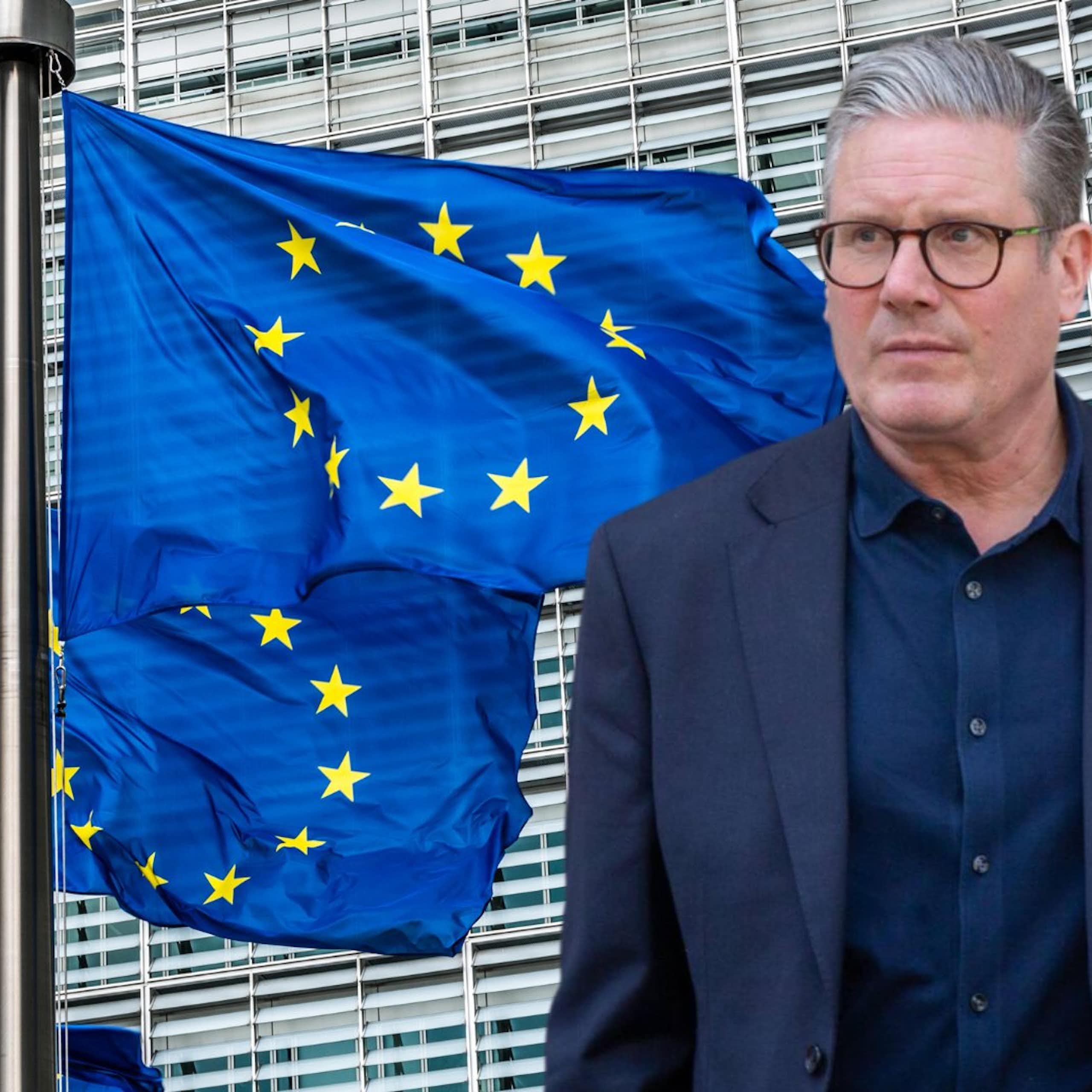 Keir Starmer looks at the EU flags outside the European Commission in Brussels
