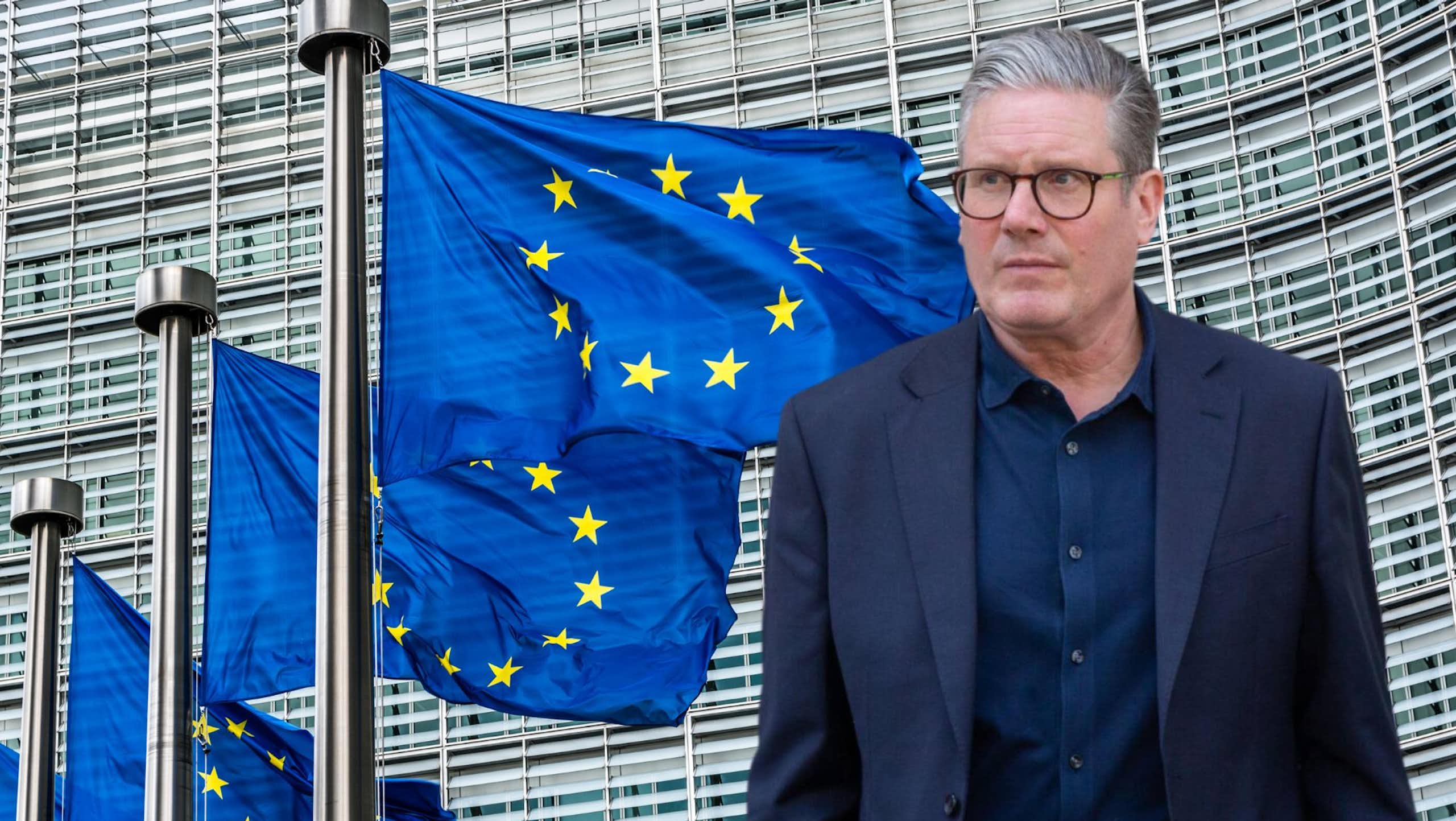 Keir Starmer looks at the EU flags outside the European Commission in Brussels