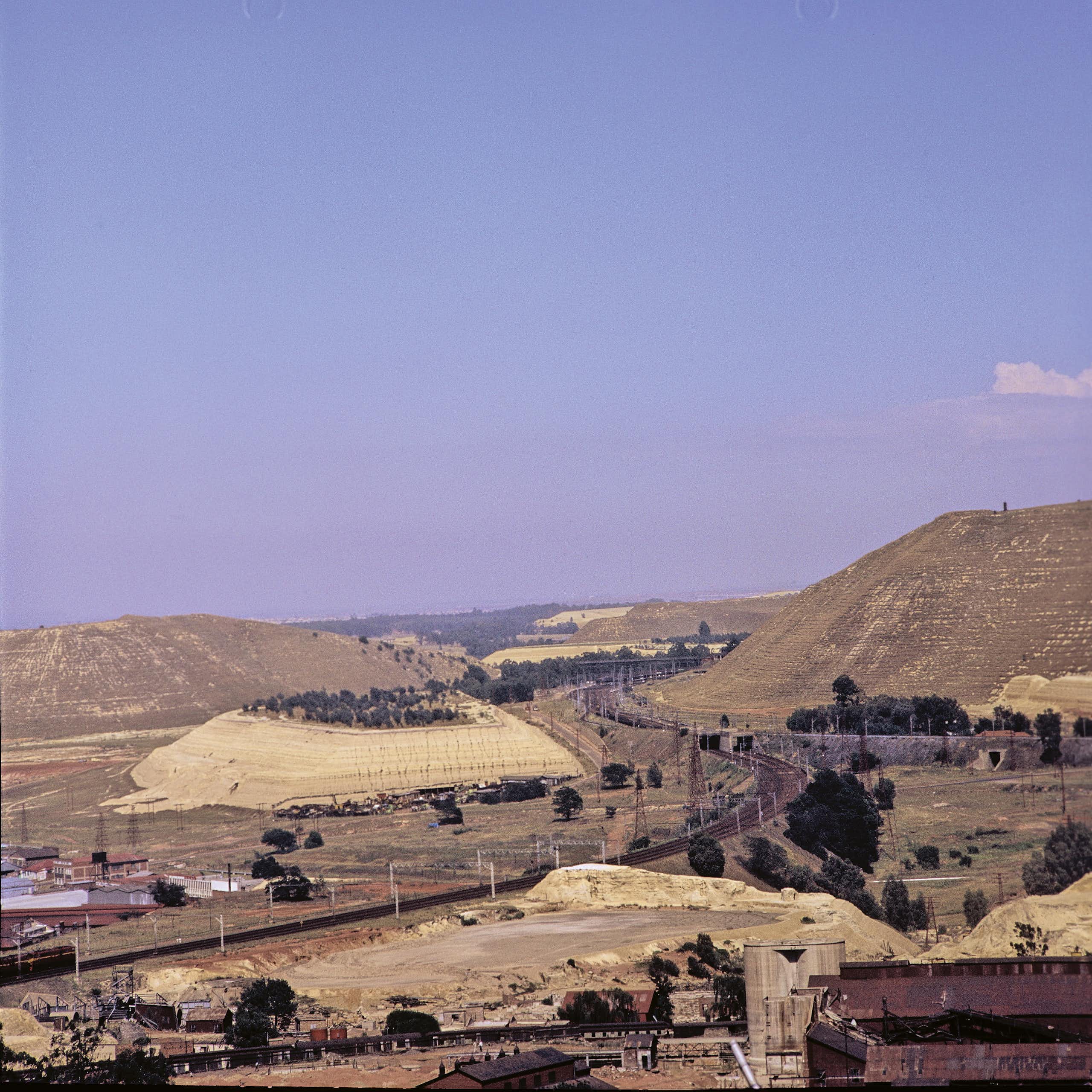 A big mound of earth next to a gold mine