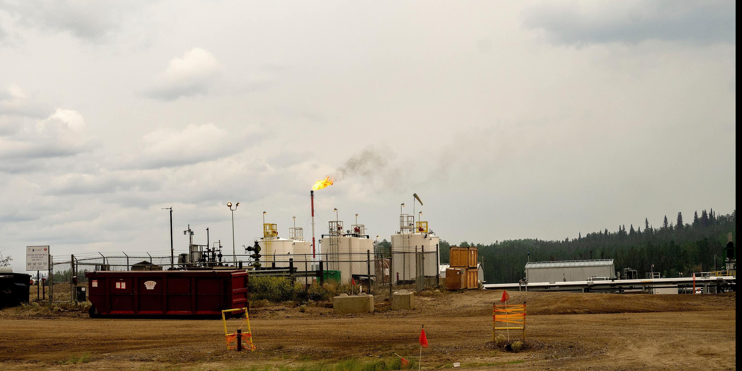 Flames rise out of a smokestack in a gas plant.