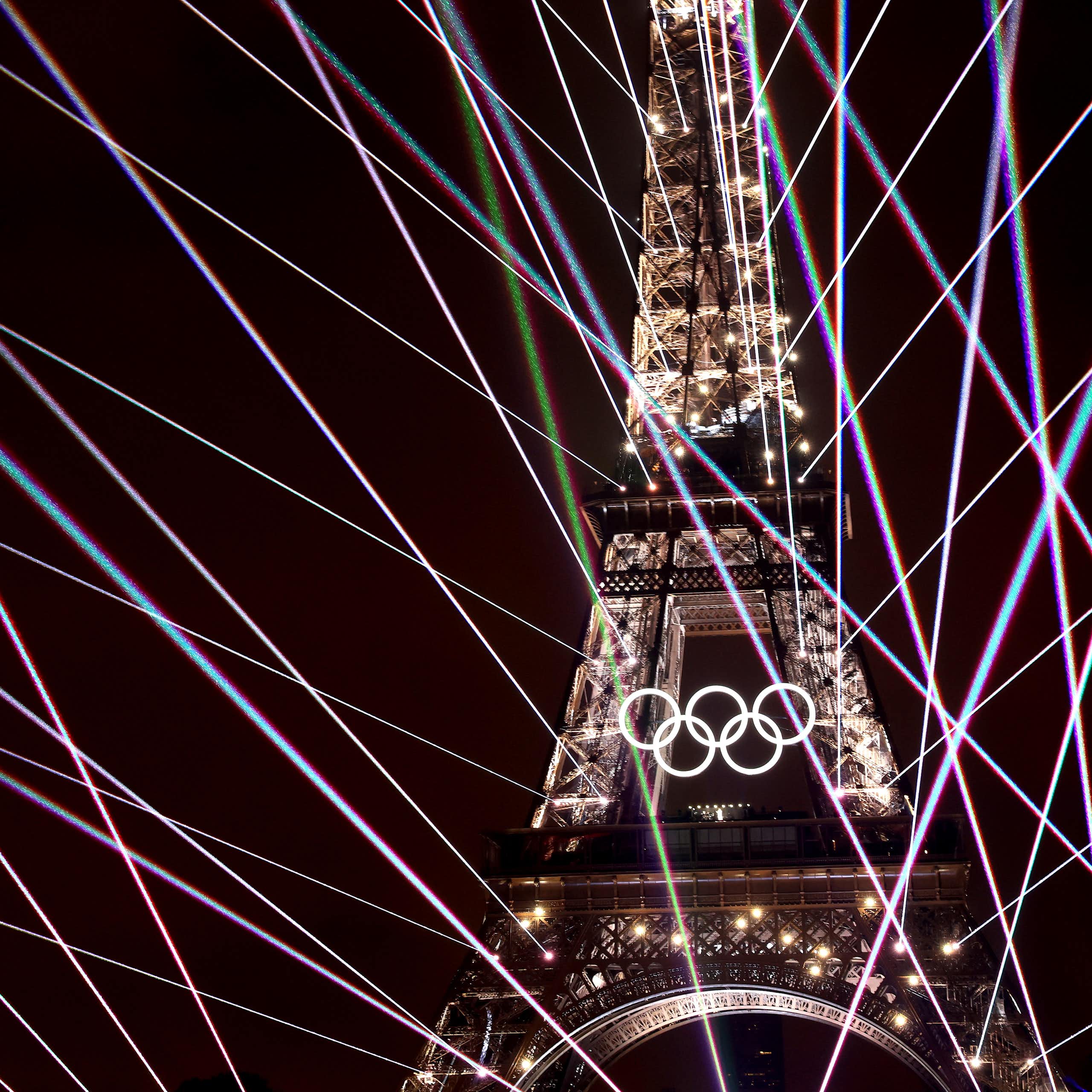 A light show illuminates the Eiffel Tower 