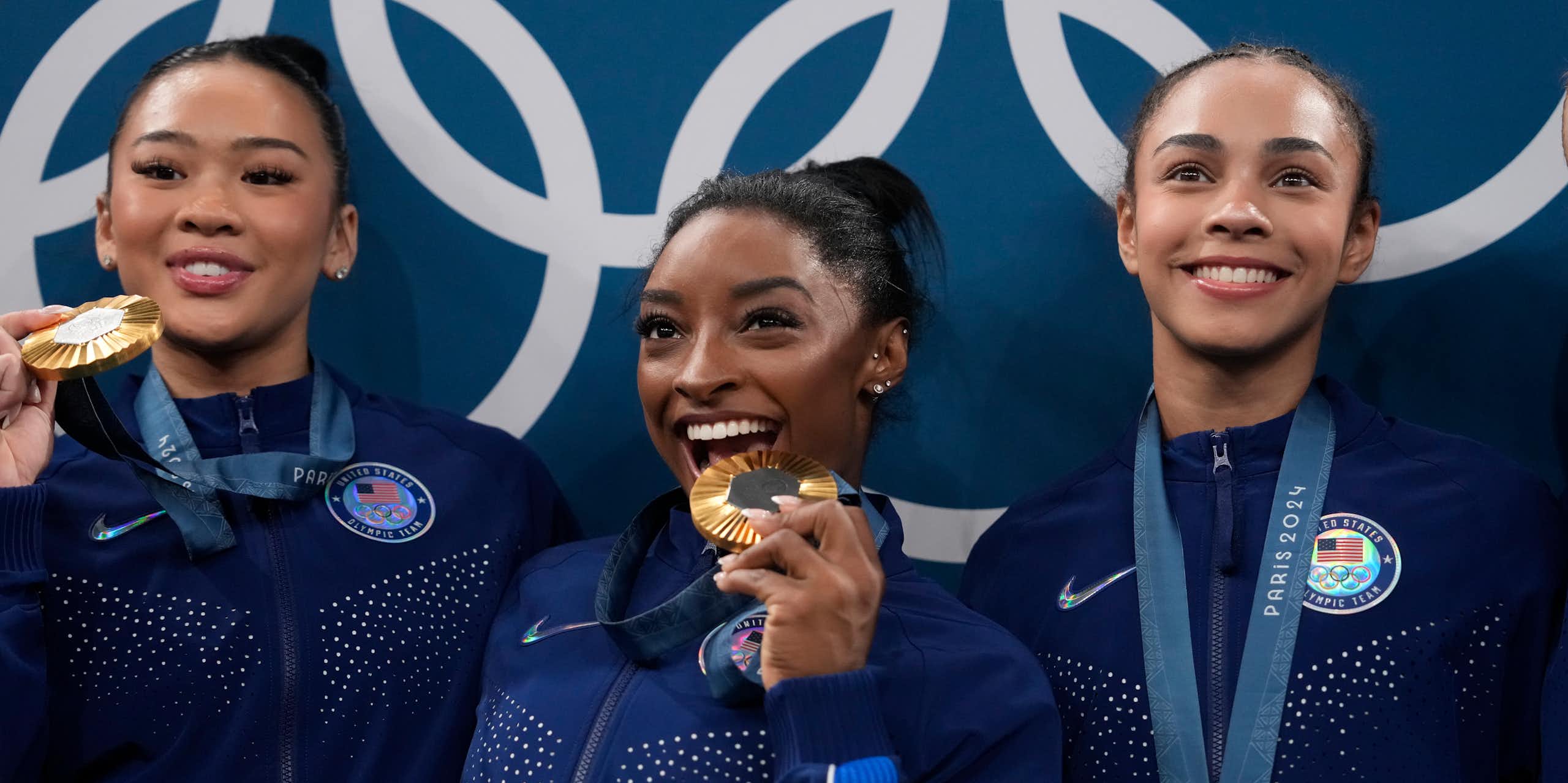 Three young women with medals