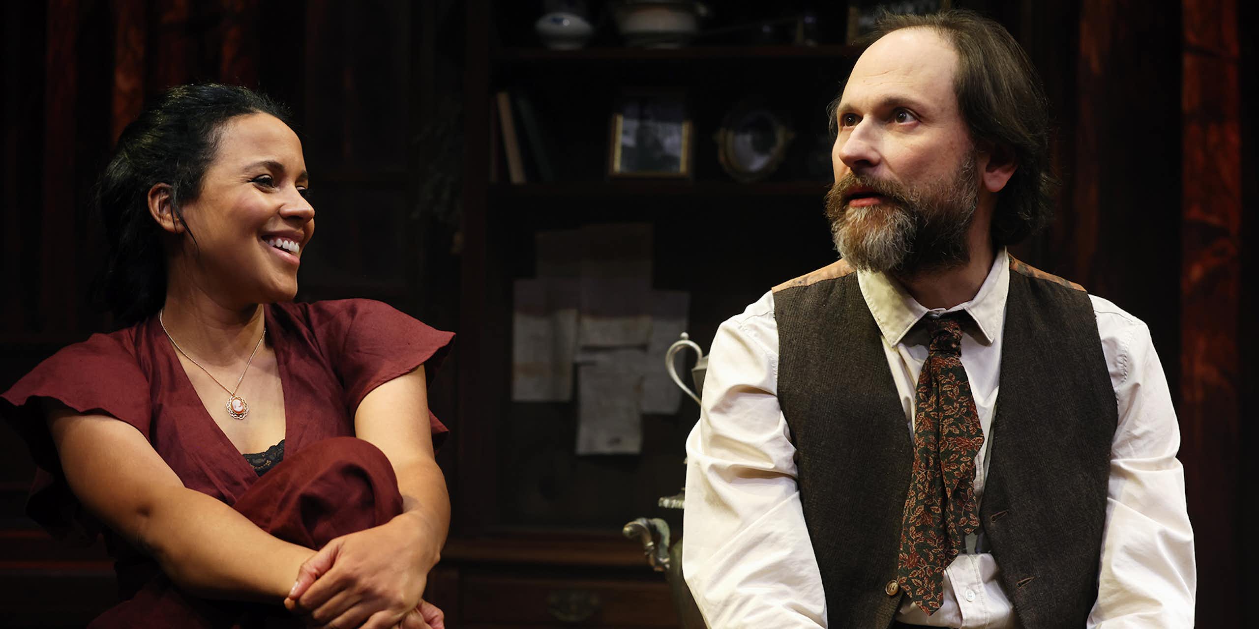 A woman and a man on stage.